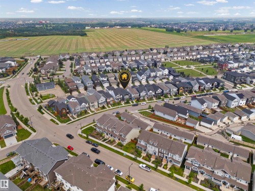 Aerial view of a residential community featuring diverse architectural styles and extensive green spaces - 2953 Coughlan Green Green, Edmonton, AB 