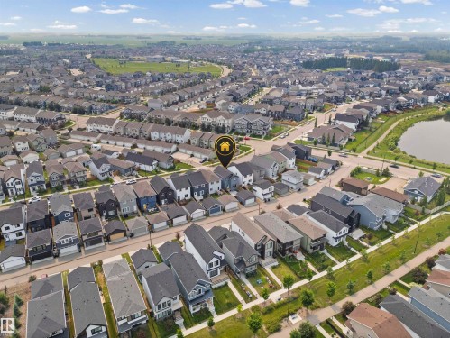 Aerial perspective of a developed residential area featuring a variety of single-family homes with individual garages - 2953 Coughlan Green Green, Edmonton, AB 