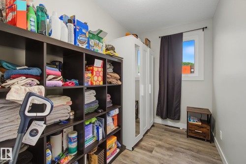 Wood-finish flooring paired with light gray walls - 3622 115 Avenue, Edmonton, AB 