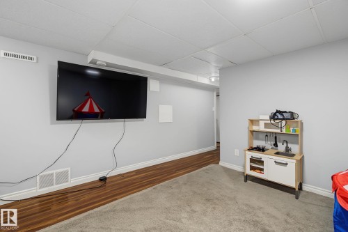 Recessed ceiling panels, light gray wall paint, and white baseboard trim - 3622 115 Avenue, Edmonton, AB 