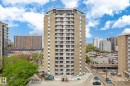 Tall residential building with multiple balconies, a rooftop amenity space, and a ground-level entrance - 503 10045 117 Street, Edmonton, AB 