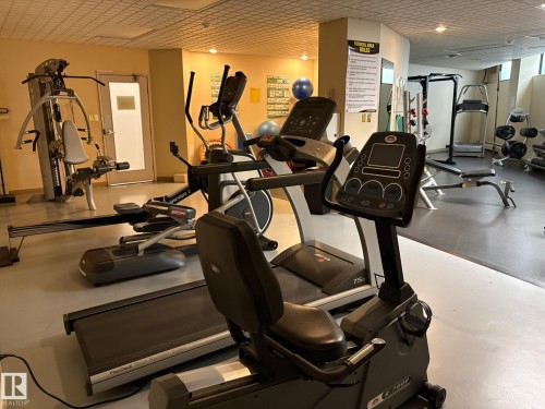 Dedicated fitness area featuring a variety of exercise equipment - 503 10045 117 Street, Edmonton, AB 