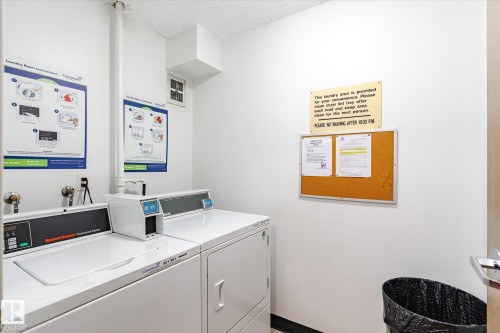 Dedicated laundry facility featuring two commercial-grade washing machines and two commercial-grade dryers - 503 10045 117 Street, Edmonton, AB 