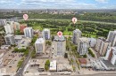 Aerial perspective showcasing urban high-rise buildings and a riverfront green space - 503 10045 117 Street, Edmonton, AB 