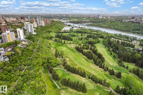 Expansive green spaces featuring a golf course, mature trees, and a riverfront setting - 503 10045 117 Street, Edmonton, AB 