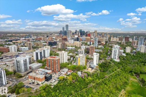 Expansive cityscape featuring a prominent skyline, dense urban development, and verdant parkland - 503 10045 117 Street, Edmonton, AB 