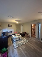 Spacious interior featuring wood-finish flooring, recessed lighting, and neutral wall tones - 
