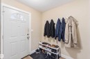 Entryway featuring a paneled door with an arched transom window - 17118 108 Street, Edmonton, AB 