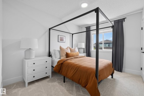 Bright room with a recessed ceiling light, a window with dark curtains, and light-toned carpet flooring - 20907 131 Avenue, Edmonton, AB 