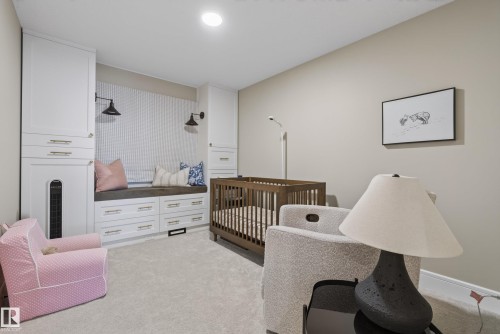 Built-in storage and window seat with integrated lighting, wood-finish flooring, and light-toned wall paint - 20907 131 Avenue, Edmonton, AB 