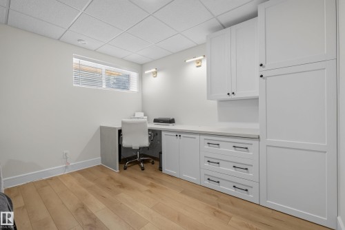 Dedicated workspace featuring wood-finish flooring, a fixed window with blinds, and recessed lighting - 20907 131 Avenue, Edmonton, AB 