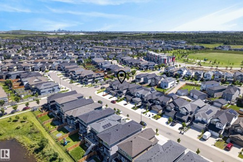 Residential community featuring detached homes and multi-story dwellings with dark roofs - 20907 131 Avenue, Edmonton, AB 