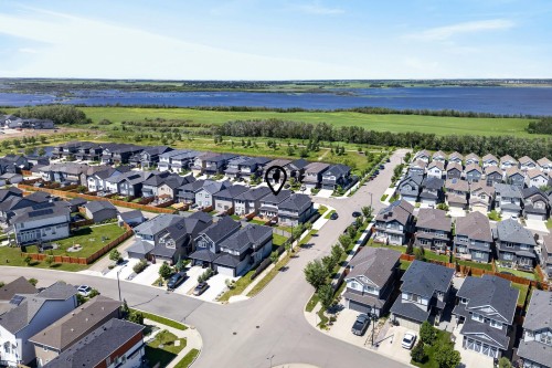 Aerial perspective showcasing a residential development with varied architectural styles and dark-shingle roofing - 20907 131 Avenue, Edmonton, AB 