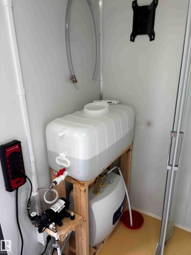 Water Reservoir and Hot Water Heater in Wash House - 304 1 Avenue, Rural Wetaskiwin County, AB 