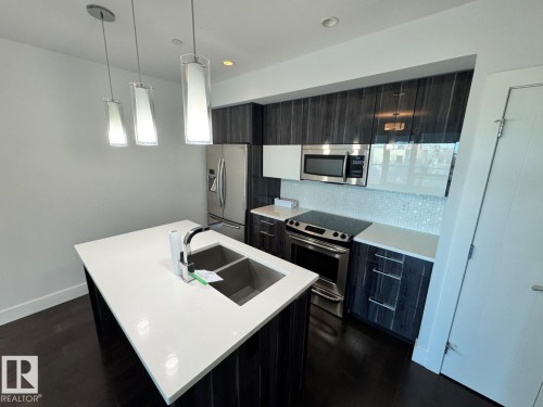 505 11969 Jasper Avenue, Edmonton, AB - Indoor Photo Showing Kitchen With Double Sink With Upgraded Kitchen