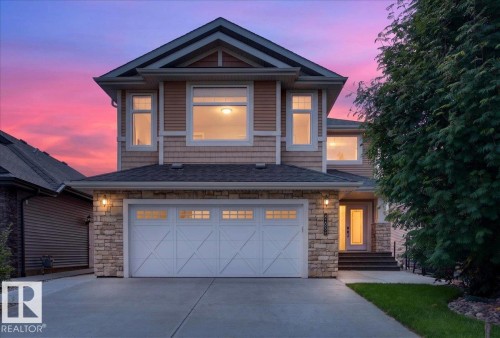 Contemporary two-story residence featuring a stone and siding facade - 8508 218 Street, Edmonton, AB 