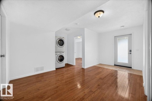 Bright room with wood-finish flooring extending throughout - 8508 218 Street, Edmonton, AB 
