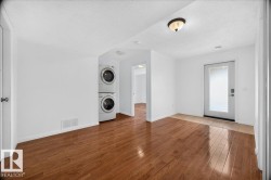 Bright room with wood-finish flooring extending throughout - 