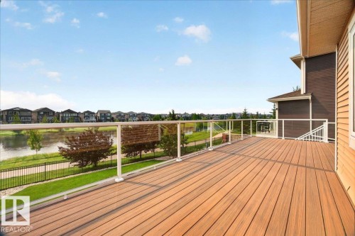 Expansive wood-finish deck with glass panel railings - 8508 218 Street, Edmonton, AB 
