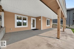 Spacious covered patio with concrete flooring - 