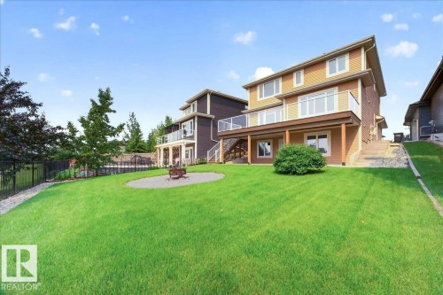 Expansive green lawn with a gravel fire pit area - 8508 218 Street, Edmonton, AB 