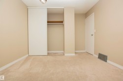 Neutral-toned carpeting paired with painted walls and white baseboards - 