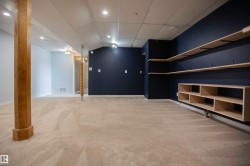 Carpeted room featuring a drop ceiling with recessed lighting - 
