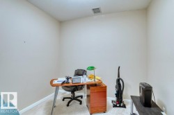 Carpeted room with neutral wall paint and white trim - 