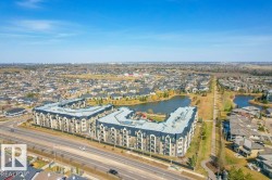 Multi-story residential buildings featuring gabled roofs and individual balconies - 
