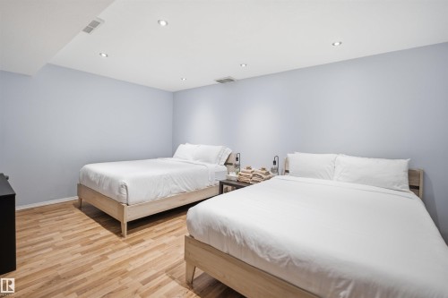 Extra beds in the basement-Recessed lighting illuminates this room featuring light wood-finish flooring and light blue walls - 92 230 Edwards Drive, Edmonton, AB 