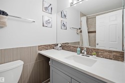 Bathroom vanity featuring an integrated rectangular sink, chrome faucet, and white countertop - 