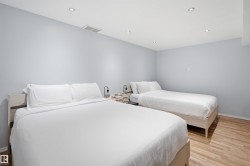 Room featuring light wood-finish flooring, recessed ceiling lighting, and light blue wall paint - 