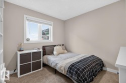 Neutral-toned walls complement the textured carpeting - 