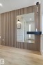 Vertical wood slat accent wall with an integrated rectangular mirror - 13152 187 Avenue, Edmonton, AB 