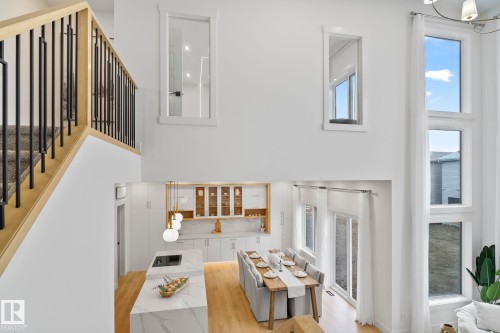 Two-story living area with high ceilings and expansive windows - 13152 187 Avenue, Edmonton, AB 
