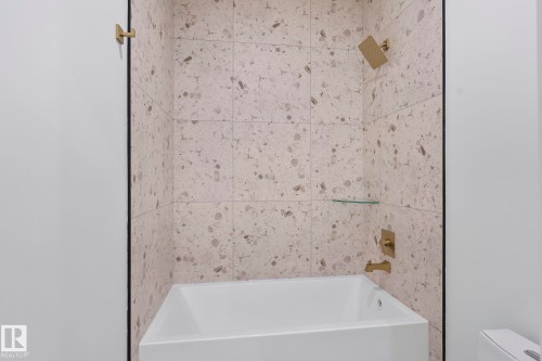 Full bathtub with a matte white finish and gold-toned fixtures - 13152 187 Avenue, Edmonton, AB 