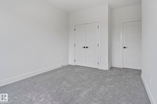 Neutral gray carpet flooring complementing bright white walls - 13152 187 Avenue, Edmonton, AB 