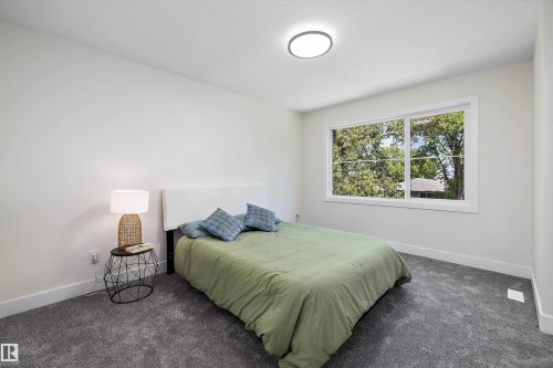 Primary bedroom with ensuite and walk in closet - 8319 81 Avenue Nw, Edmonton, AB 