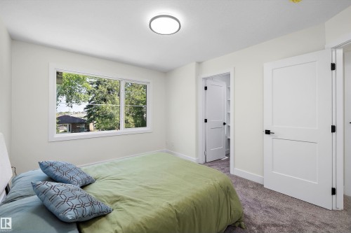 White interior walls with a large window - 8319 81 Avenue Nw, Edmonton, AB 