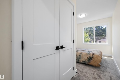 White interior doors with black hardware - 8319 81 Avenue Nw, Edmonton, AB 