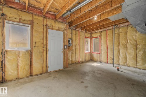 Unfinished basement space featuring exposed wood framing, ceiling joists, and concrete flooring - 4259 29 Avenue, Edmonton, AB 