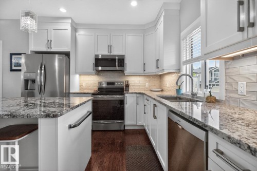 102 Kirpatrick Court, Leduc, AB - Indoor Photo Showing Kitchen With Double Sink With Upgraded Kitchen