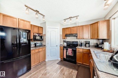 7847 7 Avenue, Edmonton, AB - Indoor Photo Showing Kitchen With Double Sink