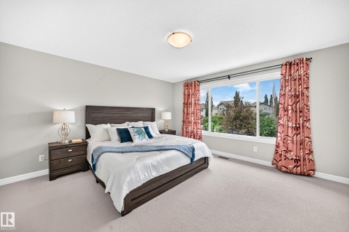 Spacious room featuring light-toned carpeting and neutral wall tones - 1330 114B Street, Edmonton, AB 
