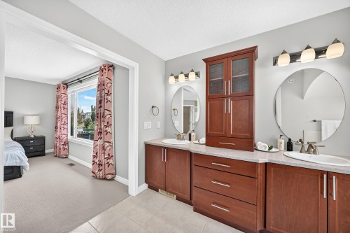 Double vanity with light-toned countertops and under-mount sinks - 1330 114B Street, Edmonton, AB 