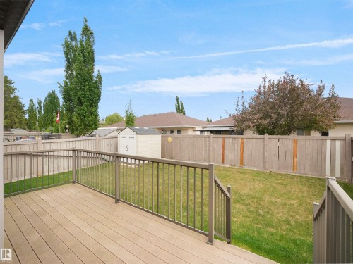 Rear deck featuring composite decking and metal railings - 45 Willow Wood Lane, Stony Plain, AB 