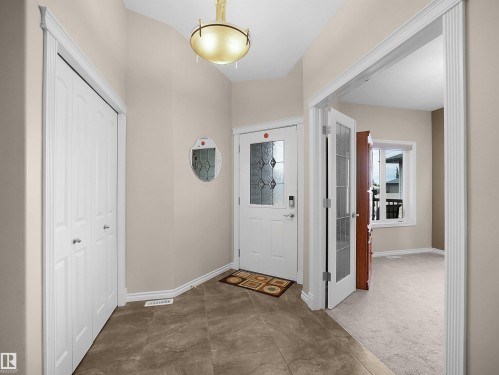 Entryway featuring neutral wall tones and tile flooring - 45 Willow Wood Lane, Stony Plain, AB 