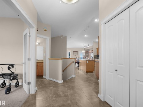 Neutral tone tile flooring extending throughout the main hall - 45 Willow Wood Lane, Stony Plain, AB 