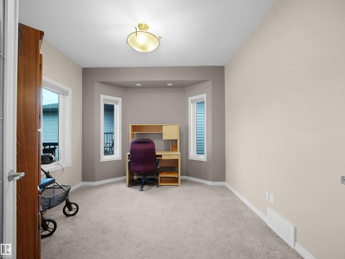 Bay window alcove with three windows, neutral wall tones, and recessed lighting - 45 Willow Wood Lane, Stony Plain, AB 