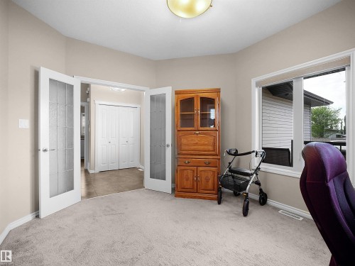 Carpeted interior space with neutral wall tones - 45 Willow Wood Lane, Stony Plain, AB 